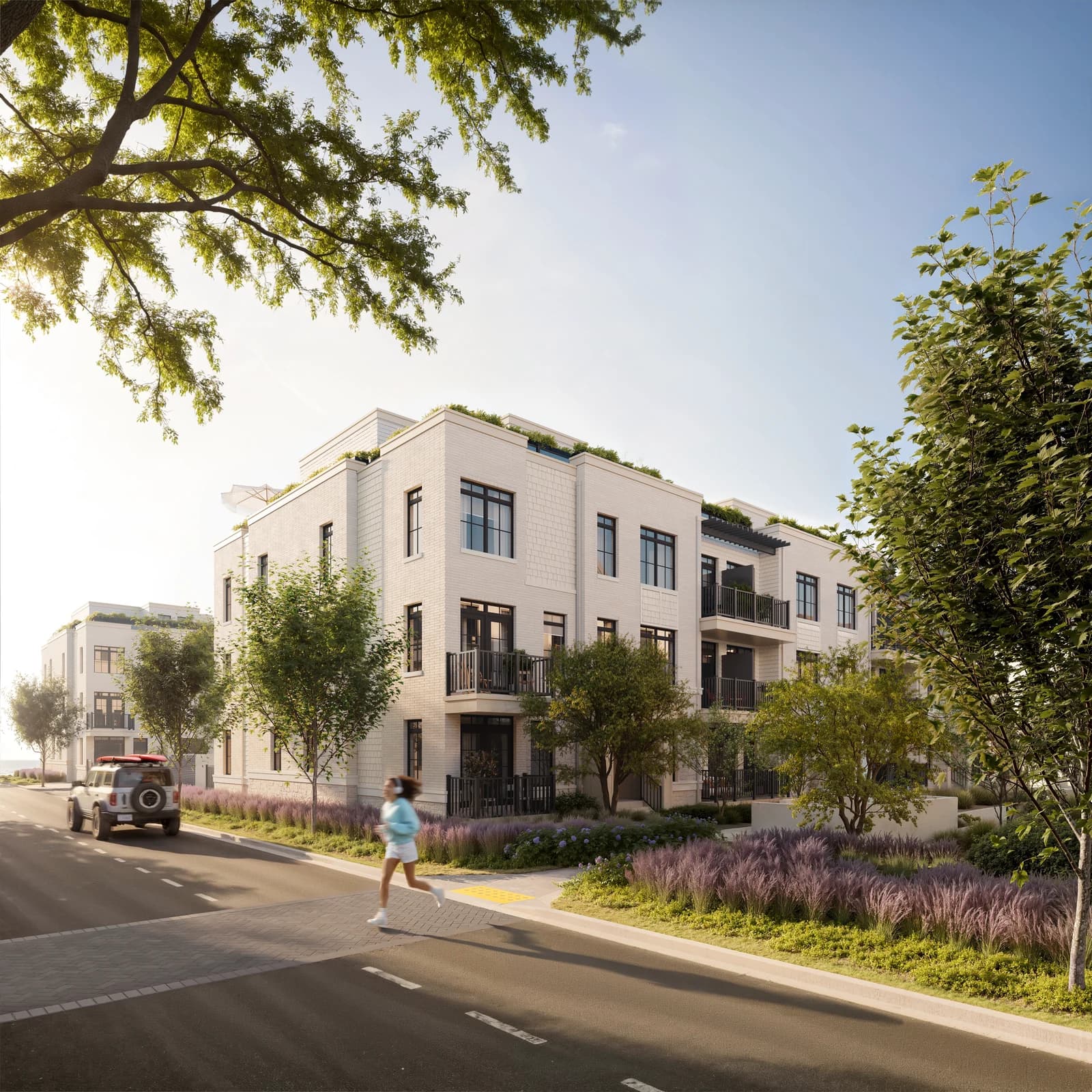 A tree-lined residential street beside South Banks townhomes